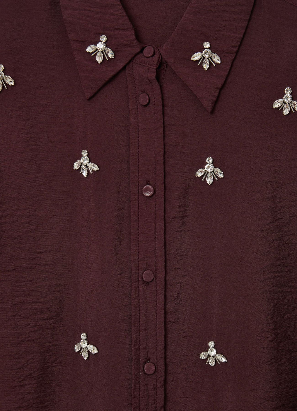 Camisa oversize con adornos