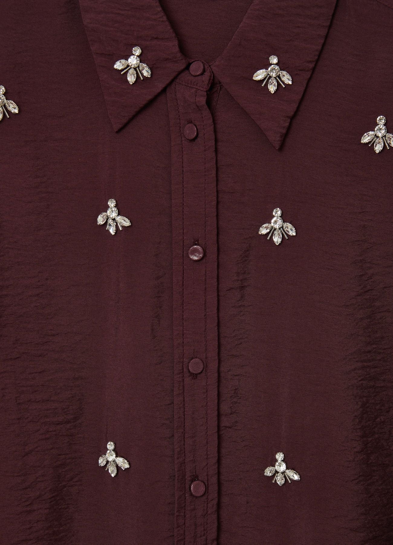 Camisa oversize con adornos