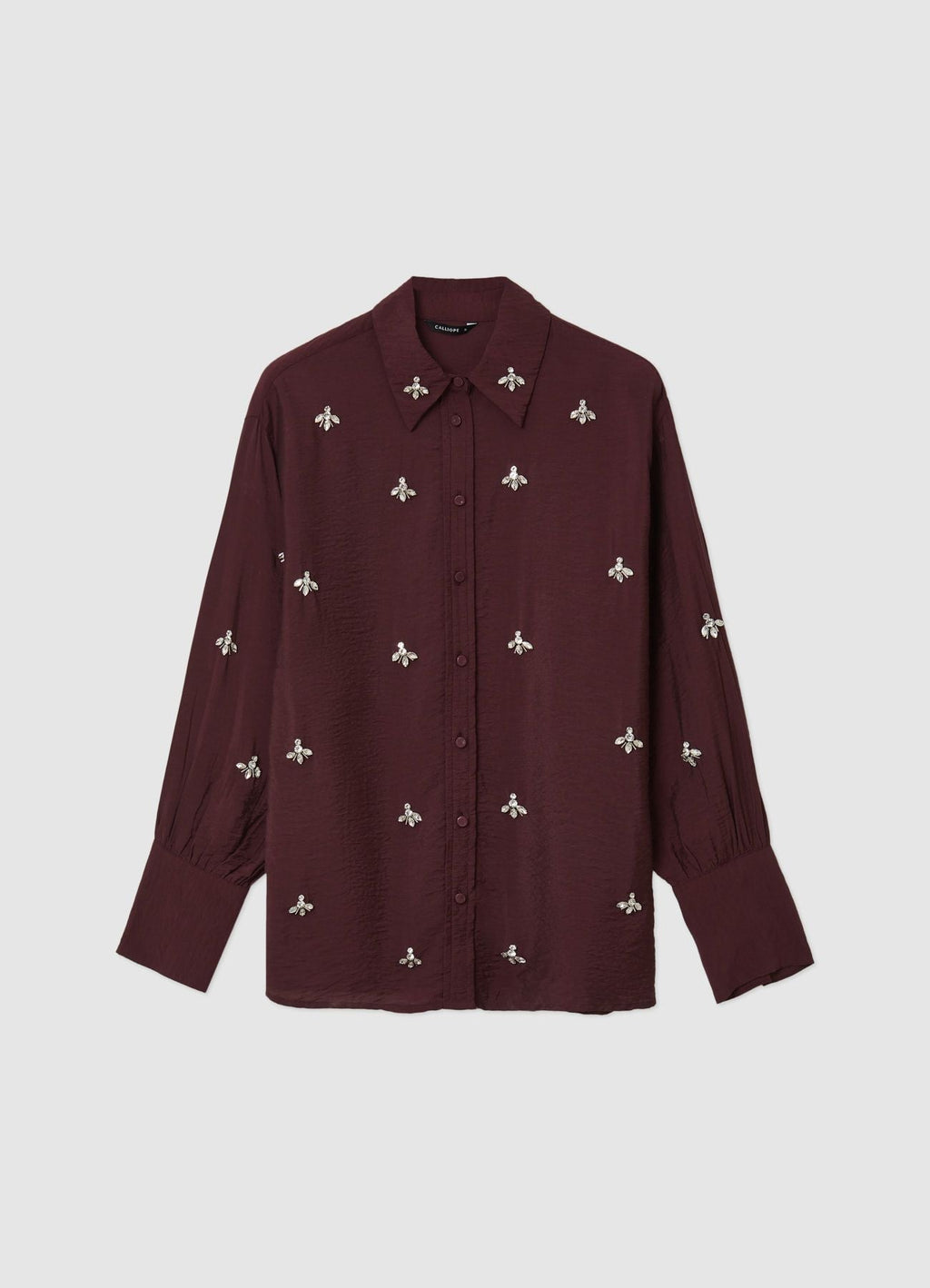 Camisa oversize con adornos